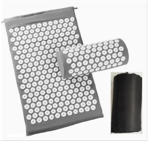 Acupressure yoga mat with white point discs and matching massage cushion