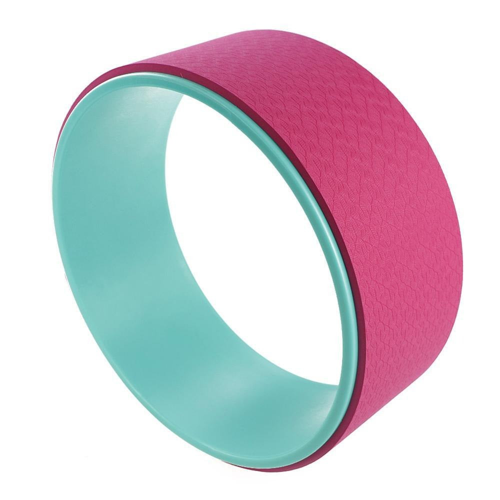 Pink and teal yoga wheel ring with teal inner surface and textured pink exterior