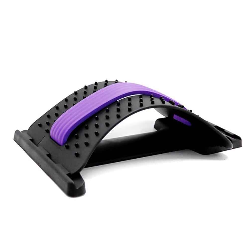 Massage stretcher with purple padded arch, black frame, and raised nubs