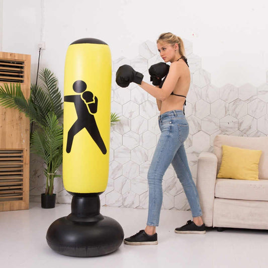 Yellow inflatable punching bag trainer with black punching figure icon and round base.